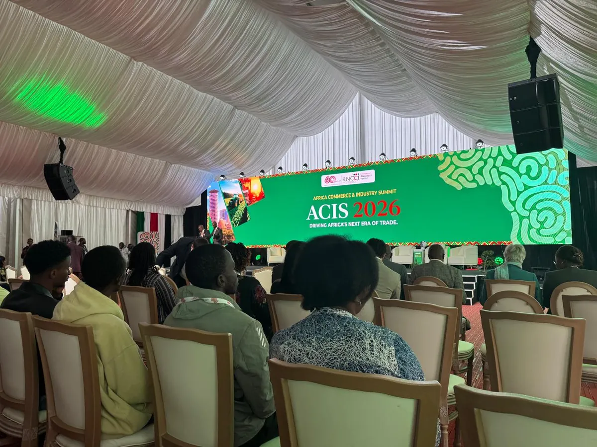 The ACIS 2026 main hall at Uhuru Gardens, with delegates seated facing the stage screen